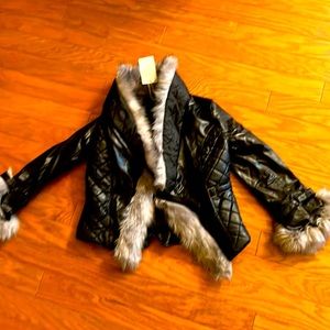A black jacket with fur around it.